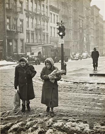 EDWARD SCHWARTZ (1906-2005) Two Women Shoppers in slush on Clinton St. & Madison St., New York. 1947.                                            